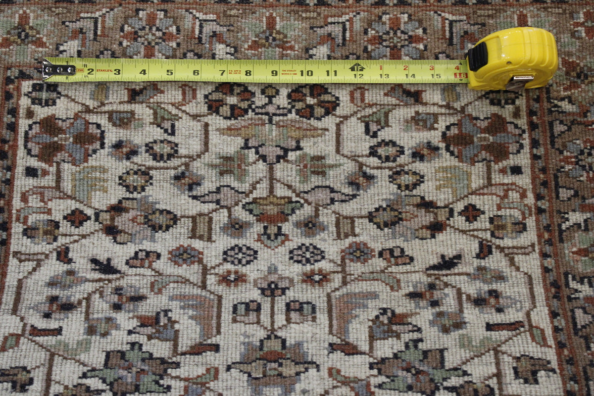 Beige Traditional Fine Herati rug in room setting