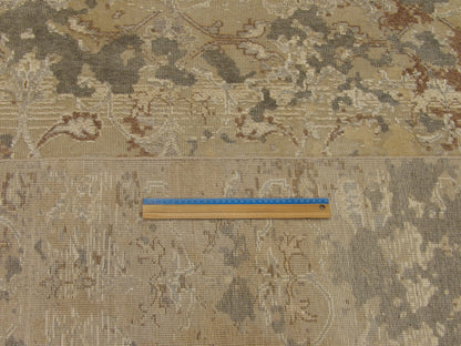Vintage green and beige rug in room setting
