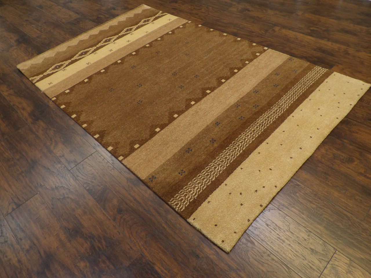 Beige and brown Gabbeh rug in a living room setting