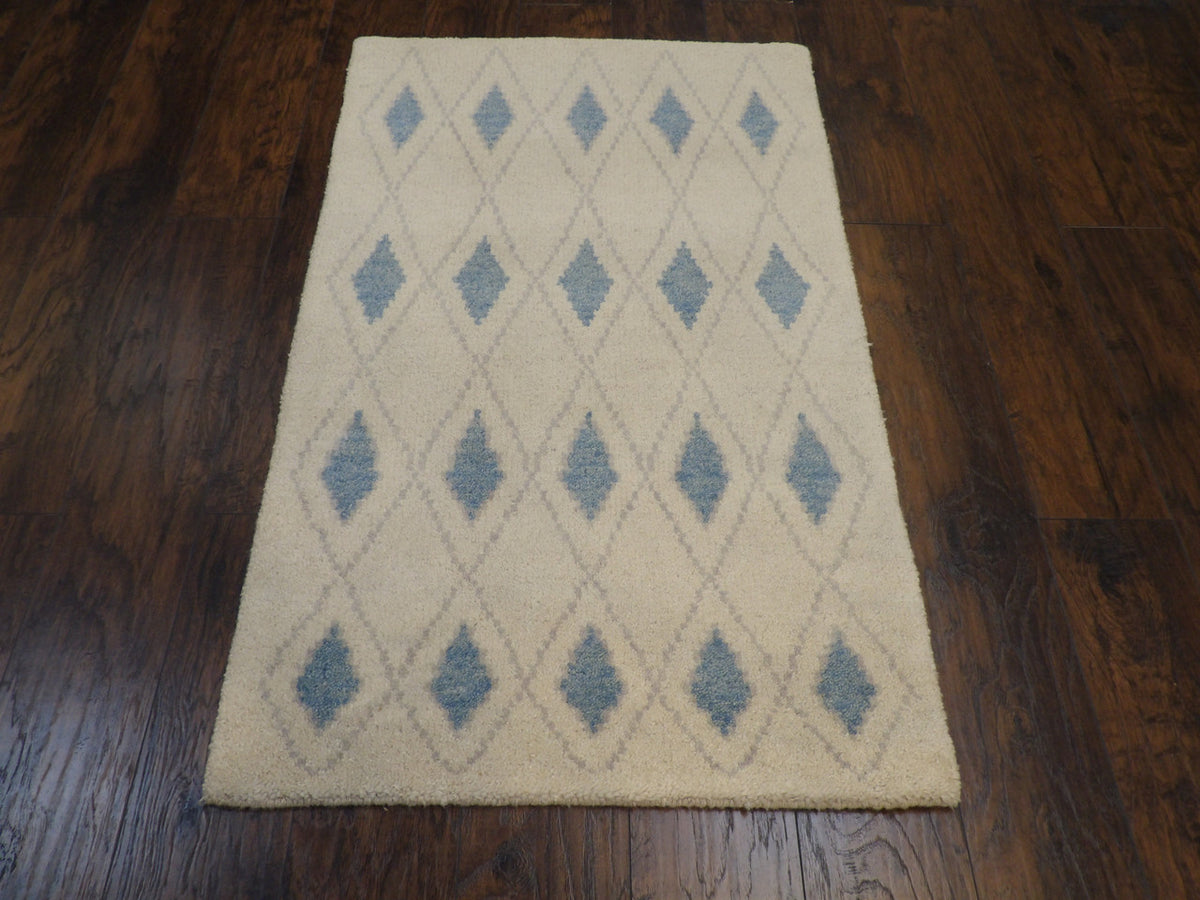 Close-up of wool pile, blue and ivory rug