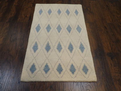 Close-up of wool pile, blue and ivory rug