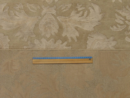 Beige floral rug in room setting