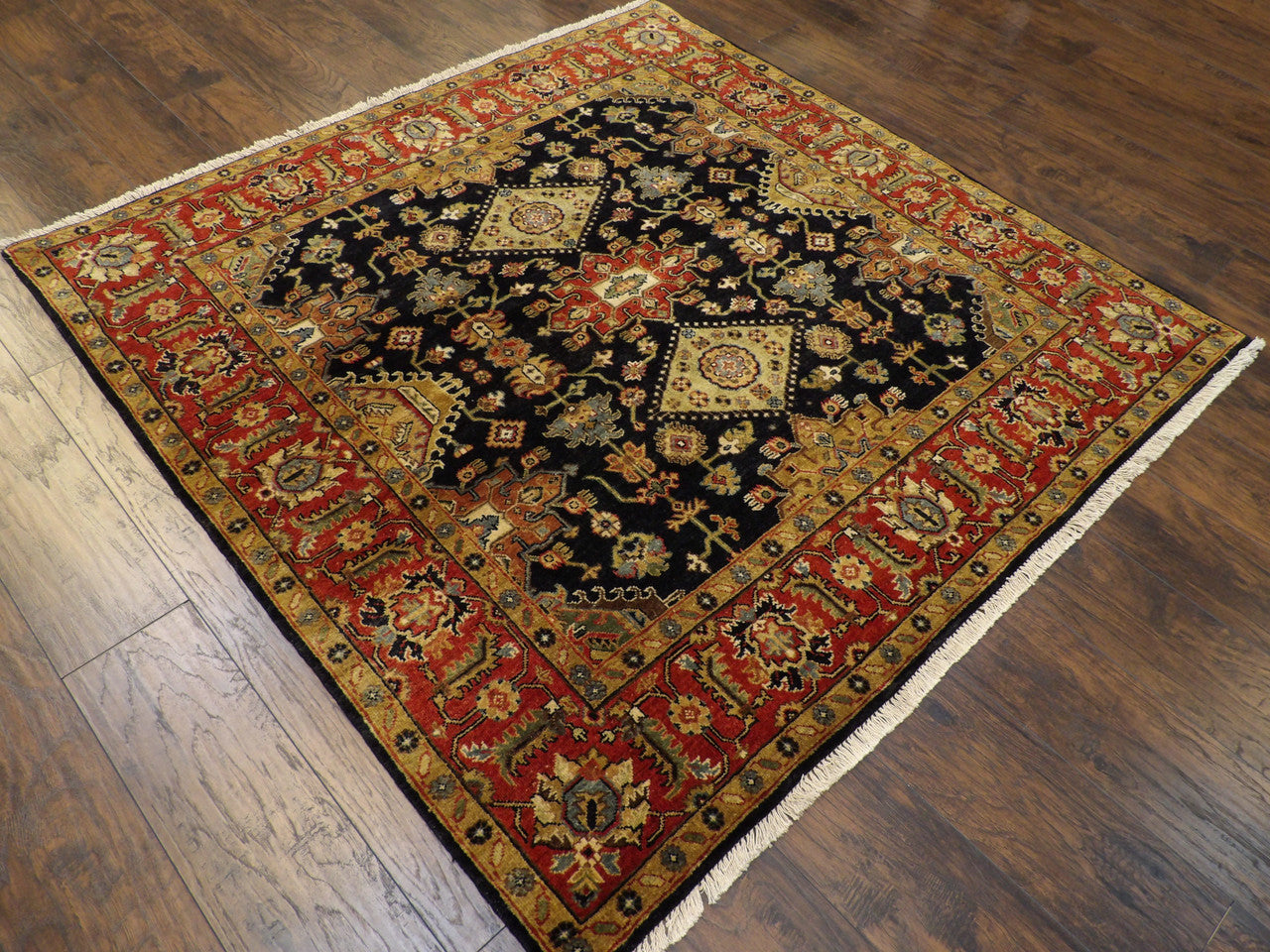Brown and blue Sherapi wool rug in a living room setting