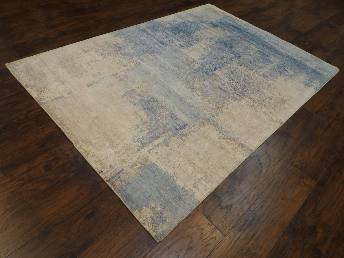 Blue and brown abstract rug in a living room setting