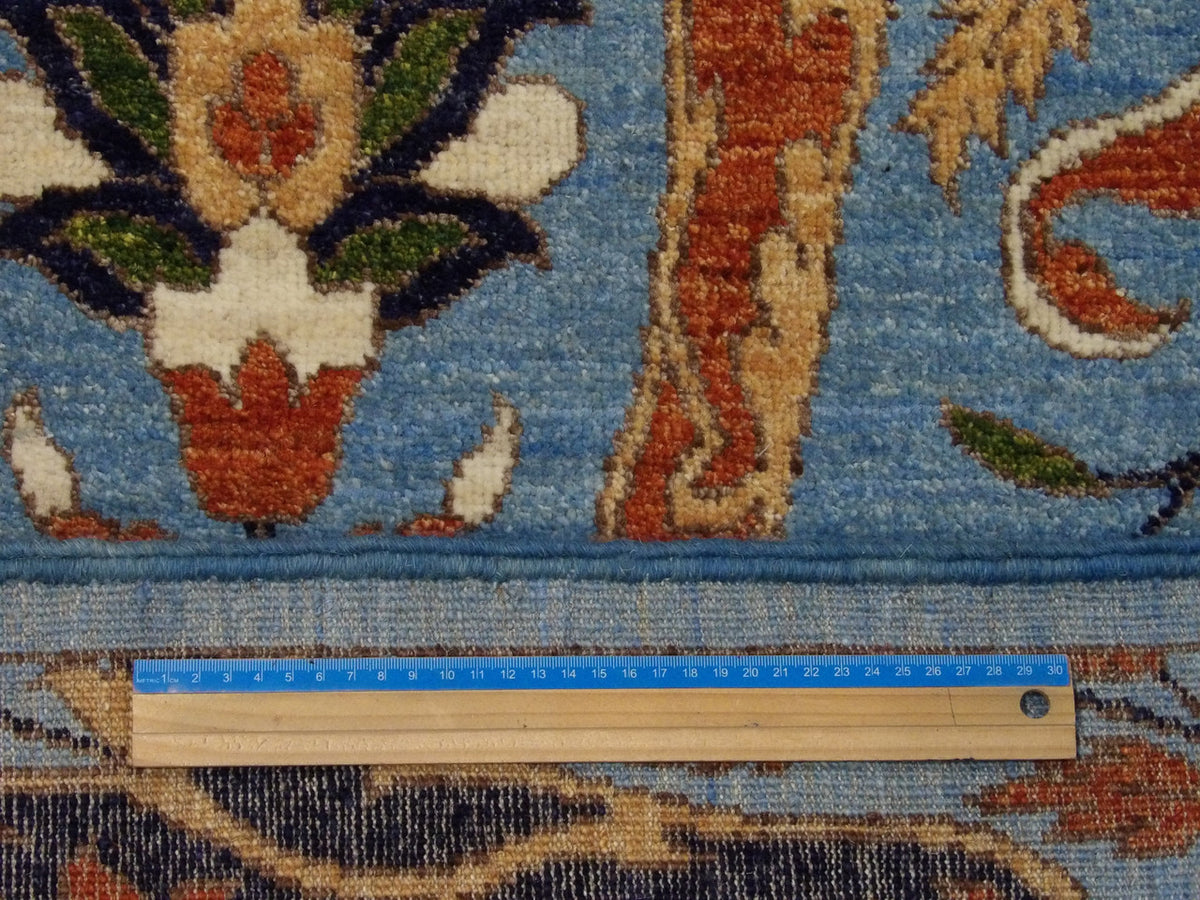 Blue & Rust Transitional Ikat Design Natural Dye rug in room setting