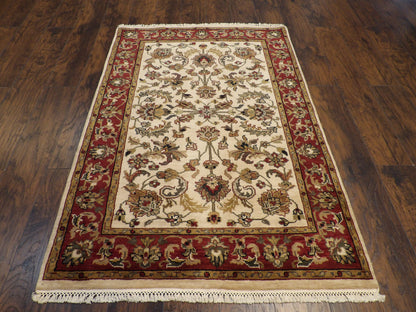 Close-up of wool pile, beige and red rug