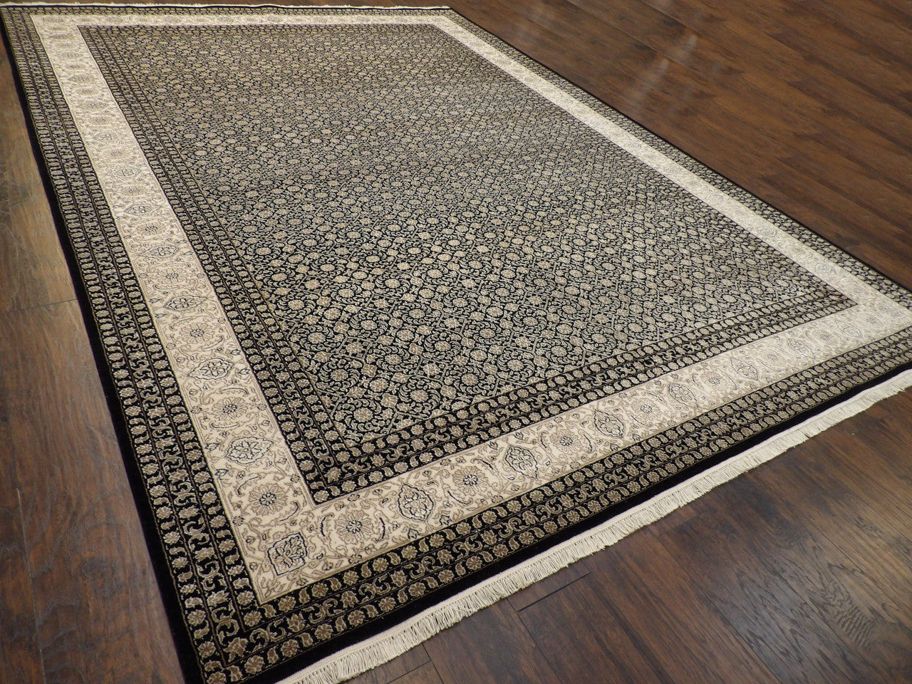 Black Persian Mir rug in a formal room setting