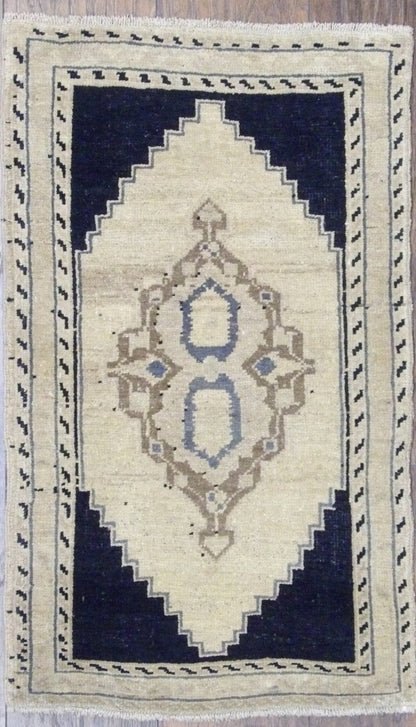 Antique Turkish Yastik hand-knotted wool rug in beige and black, full view, 2x3