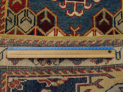 Gold & Ivory Tribal Kazak rug in room setting