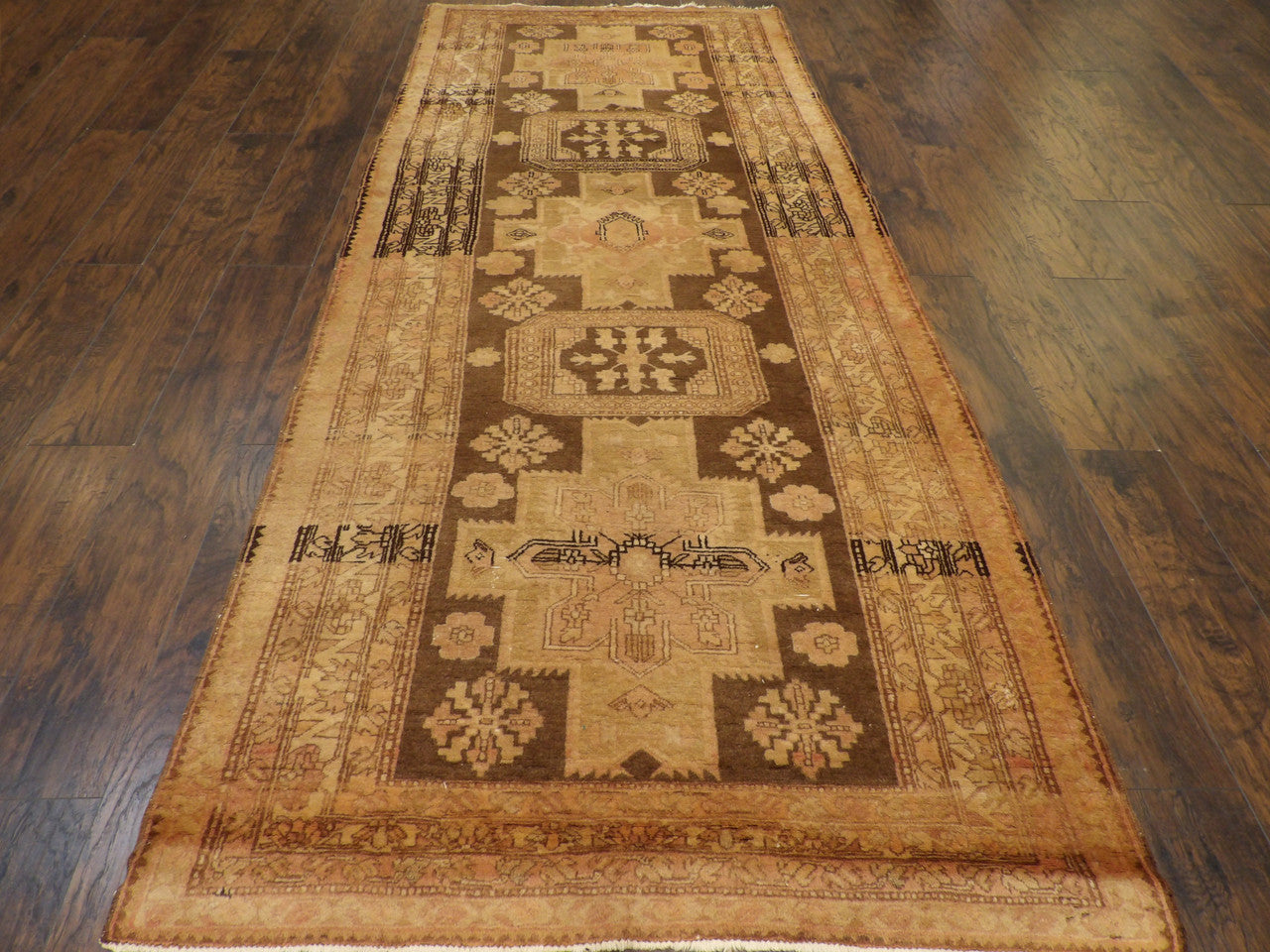 Close-up of aged wool pile on antique Khotan runner