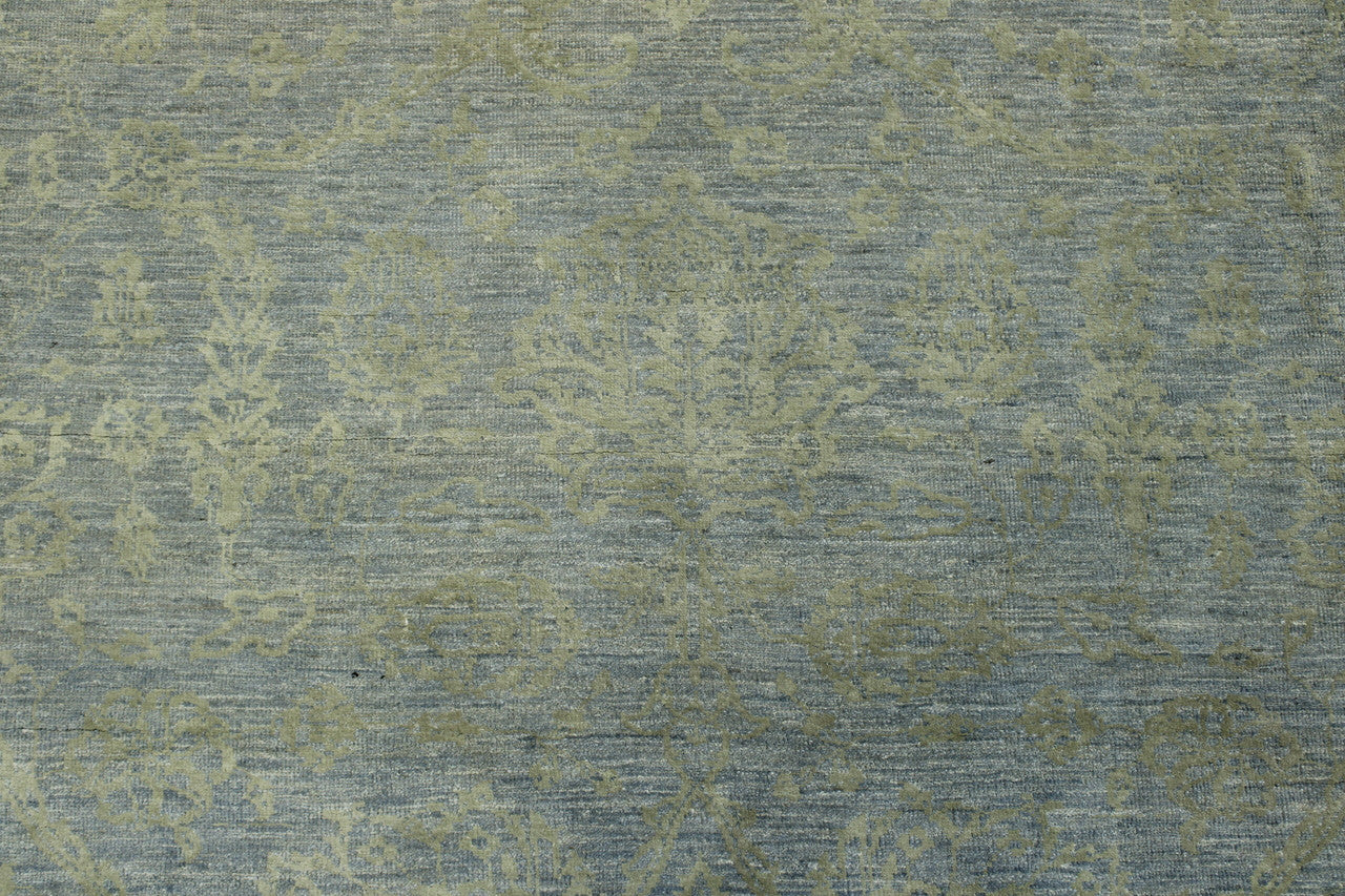Blue, Gray & Gold Oushak Bamiyan Chobi rug in room setting