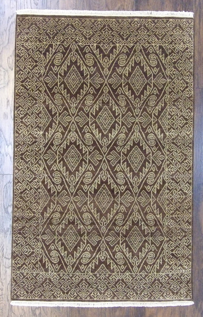 Transitional Ikat natural dye hand-knotted wool rug in beige and brown, full view