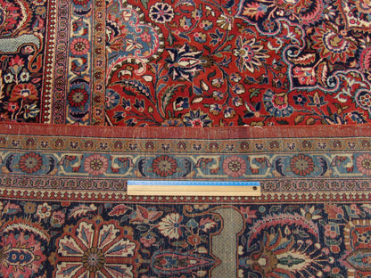 Blue and red antique Tabriz rug in room setting