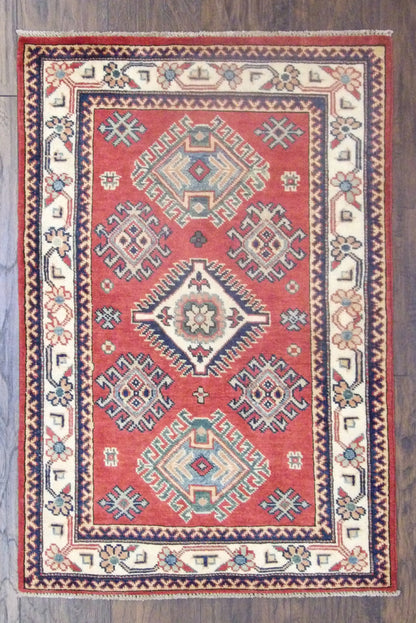 Tribal Super Kazak hand-knotted wool rug in beige and red, full view