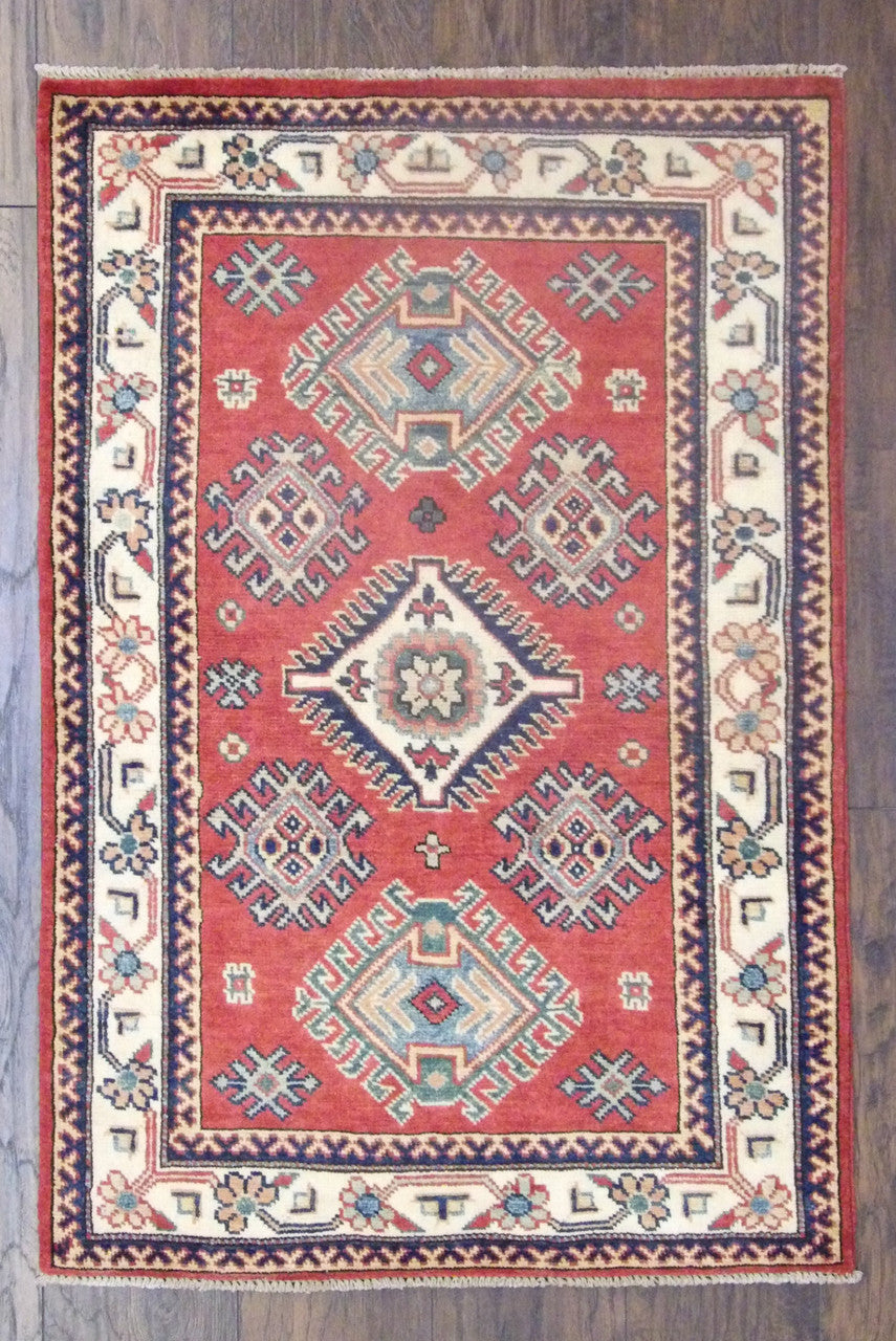 Tribal Super Kazak hand-knotted wool rug in beige and red, full view