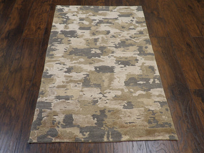 Close-up of wool-silk pile, gold and gray rug