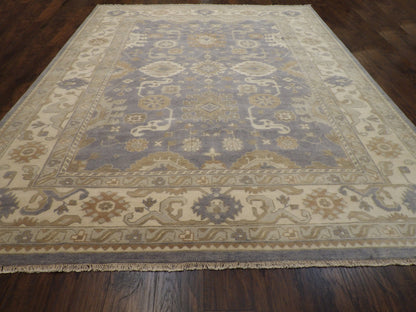Ivory and purple Oushak rug in a living room setting
