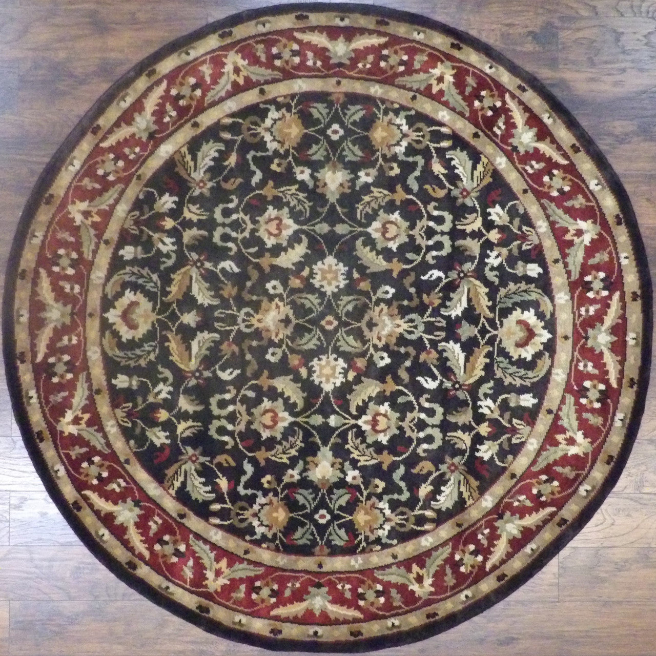 Indo Ziegler hand-knotted wool round rug in black and red, full view