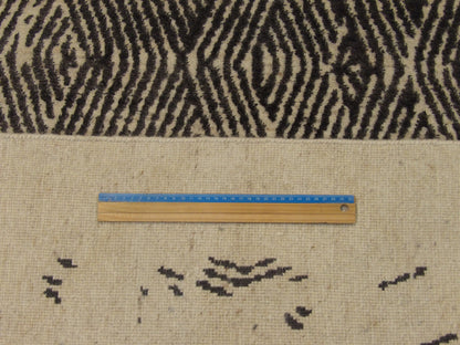 Black & Beige Modern Broken Net Design rug in room setting