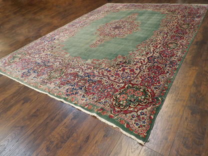 Green & Red Antique Persian Kerman rug in room setting