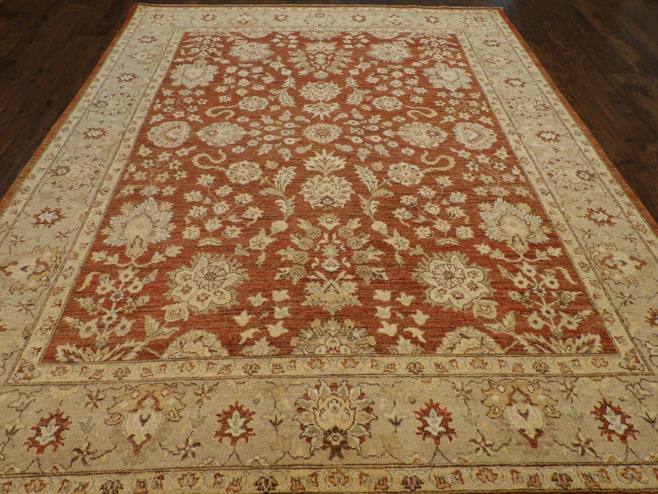 Close-up of wool pile, gold and rust rug