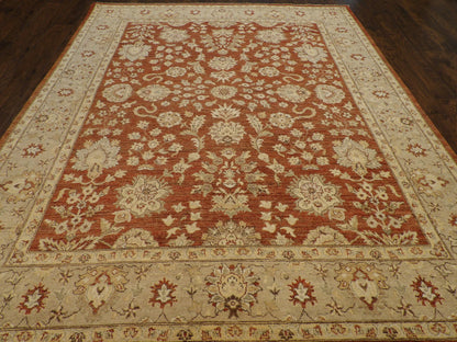 Close-up of wool pile, gold and rust rug