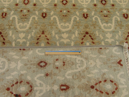 Blue and red Oushak rug in room setting