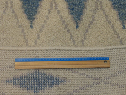 Blue and ivory Moroccan rug in room setting