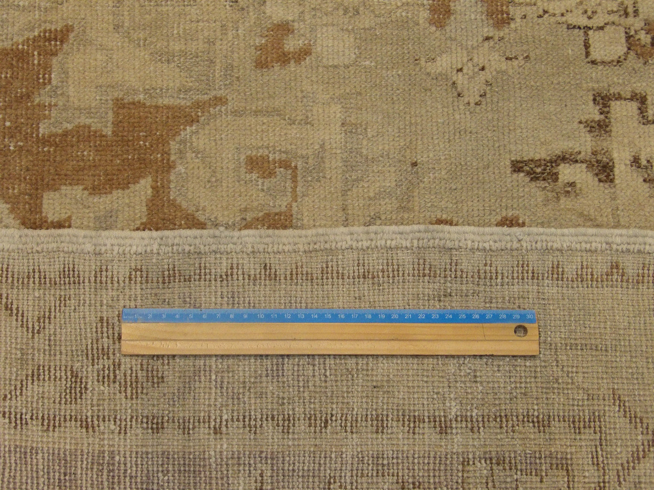 Blue and brown Oushak rug in room setting