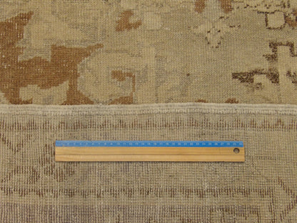 Blue and brown Oushak rug in room setting