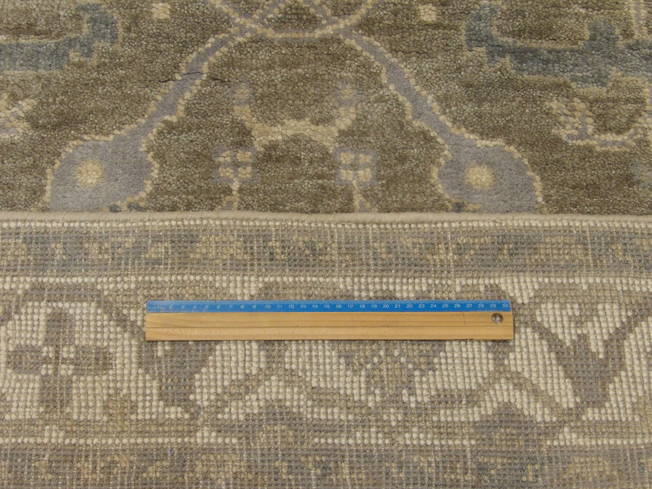 Gray and beige Oushak runner in hallway setting