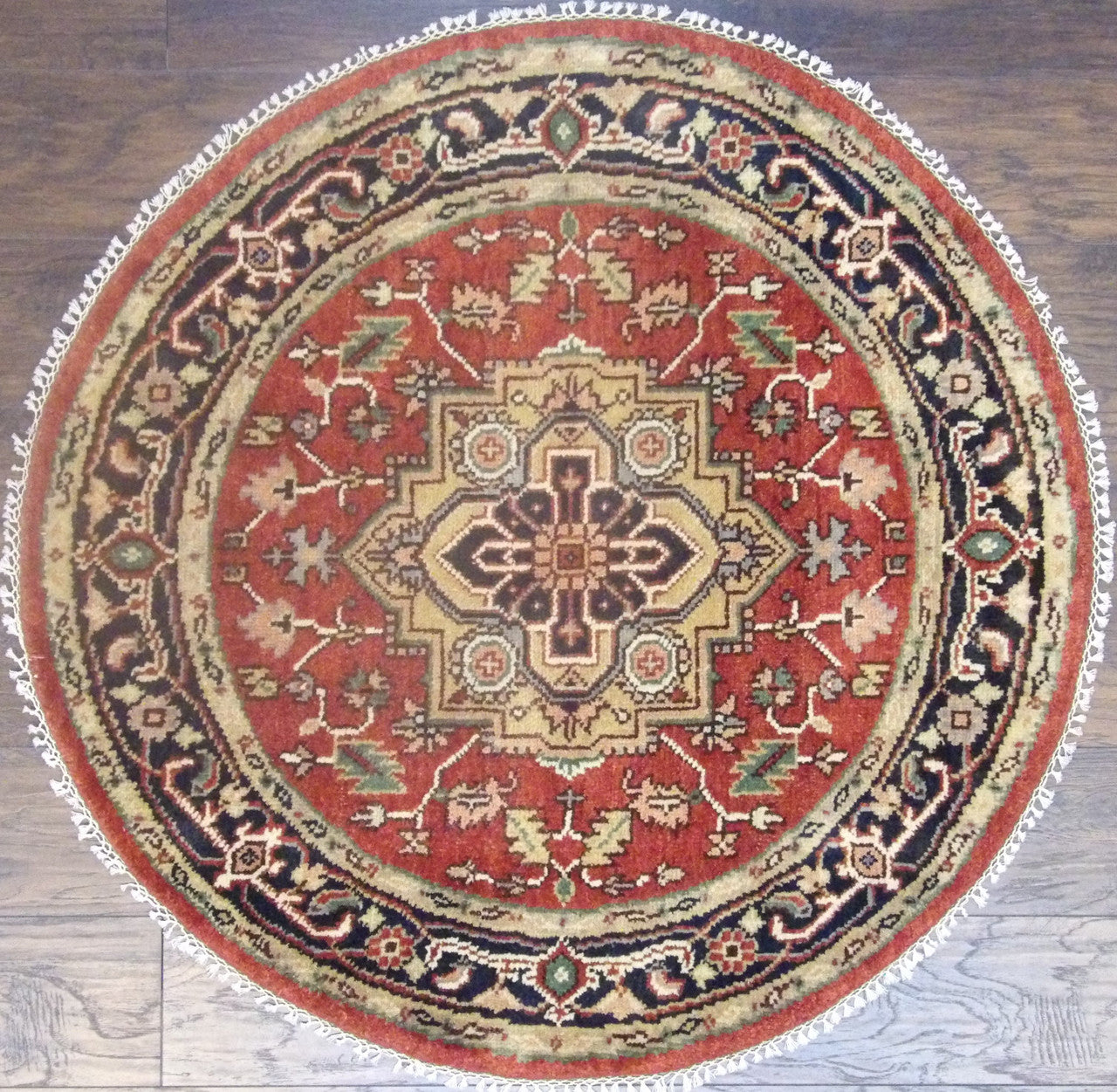 Tribal Heriz hand-knotted wool round rug in blue and red, full view