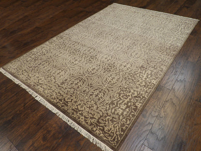 Damask pattern detail on brown and gold hand-knotted rug