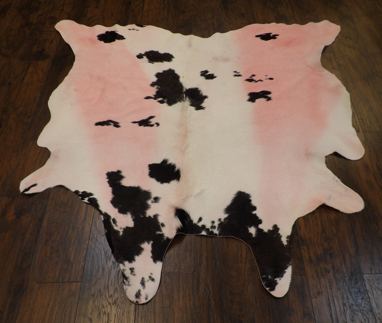 Back of genuine cowhide rug showing hide backing
