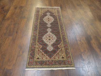 Teal Persian runner in a hallway setting