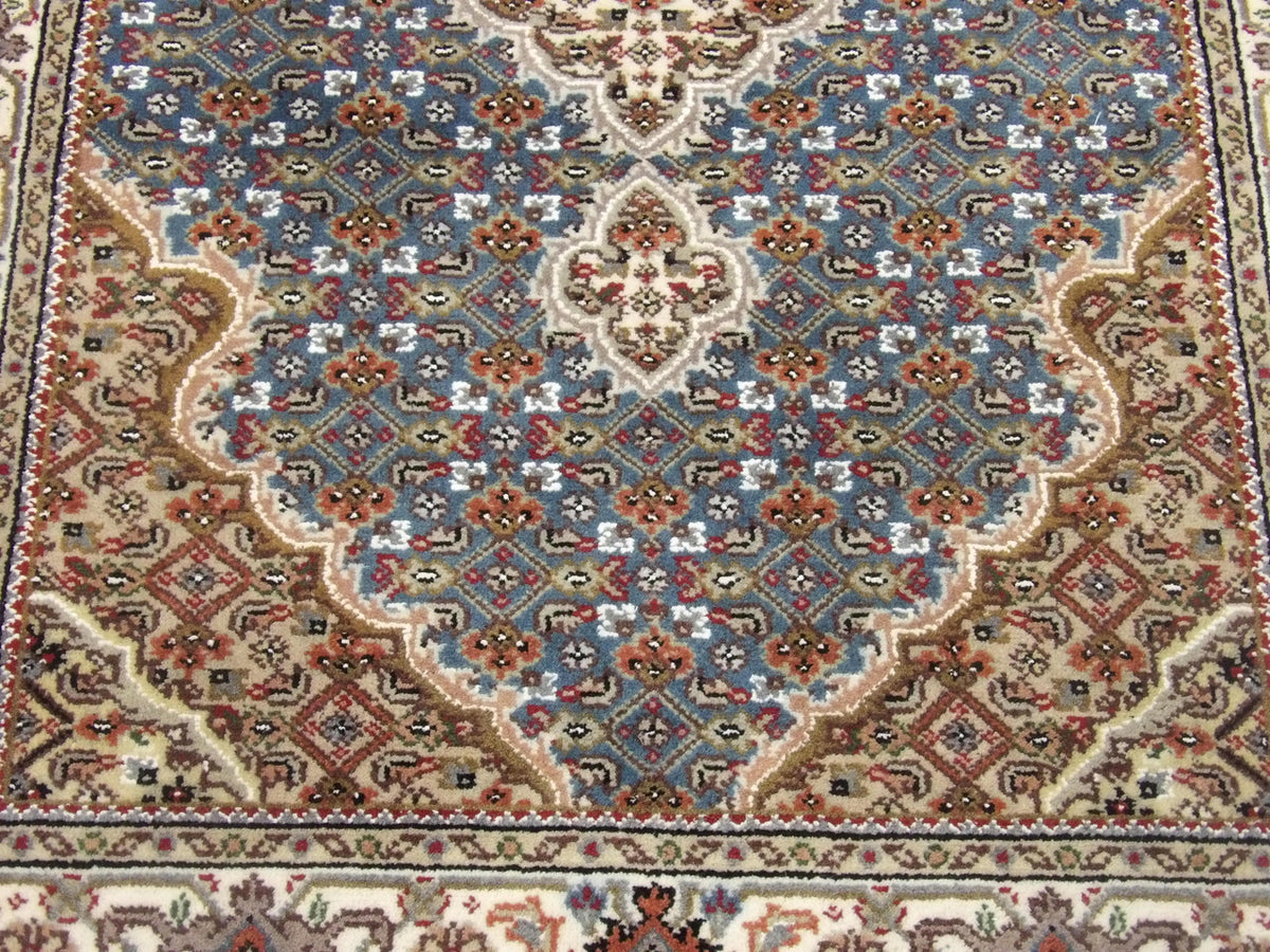 Back of Tabriz hand-knotted rug