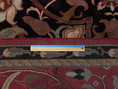 Black & Red Tibetan Mashad Design rug in room setting