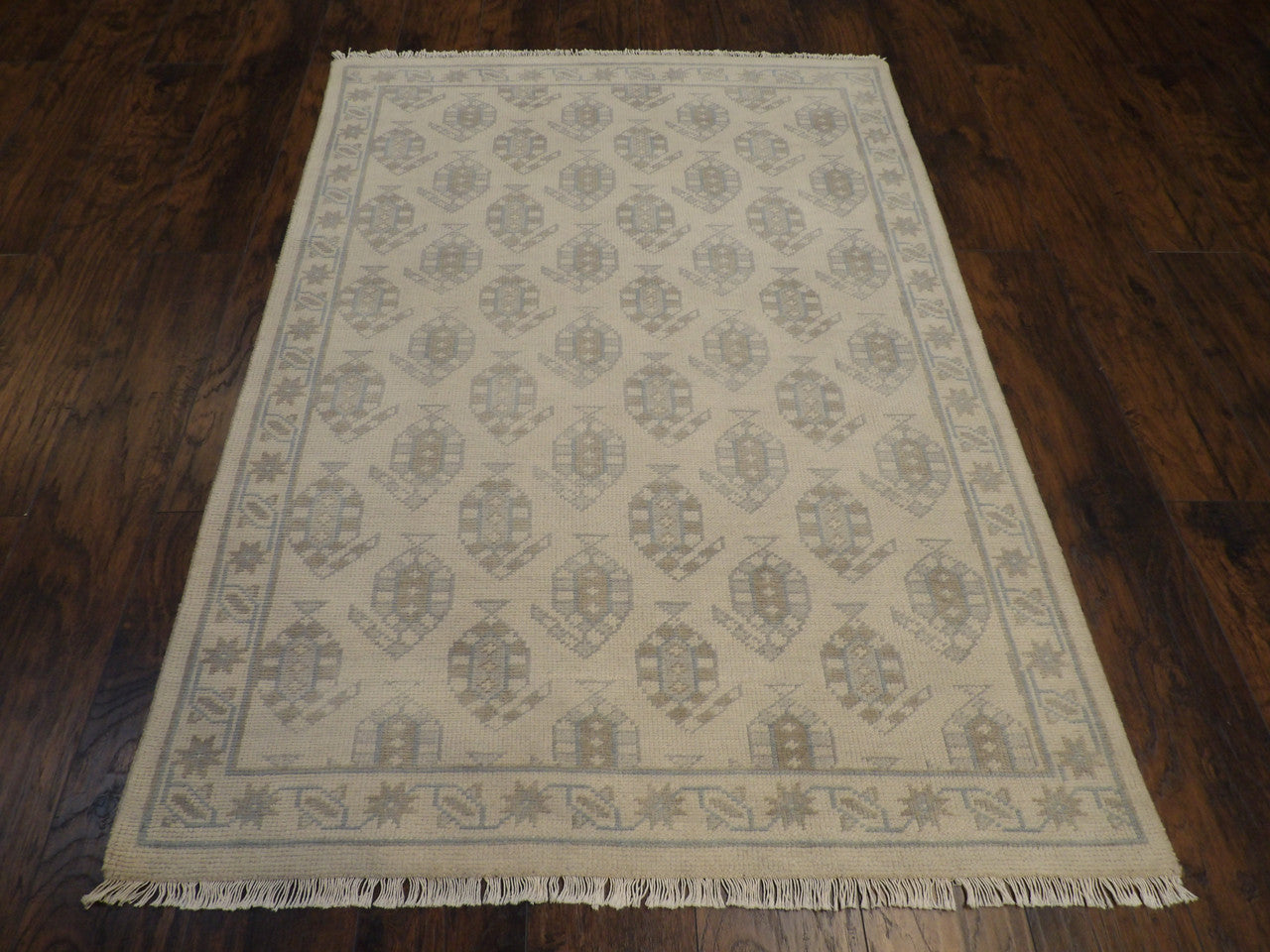 Close-up of wool pile, blue and beige rug