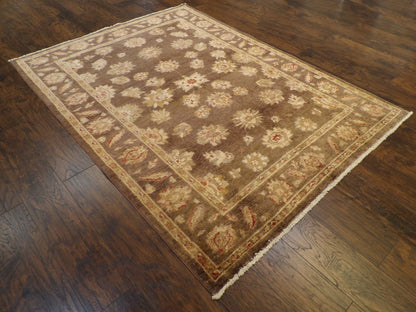 Chobie antique wash pattern detail, brown and gold rug