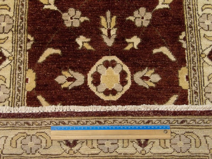 Brown and ivory Oushak runner in hallway setting
