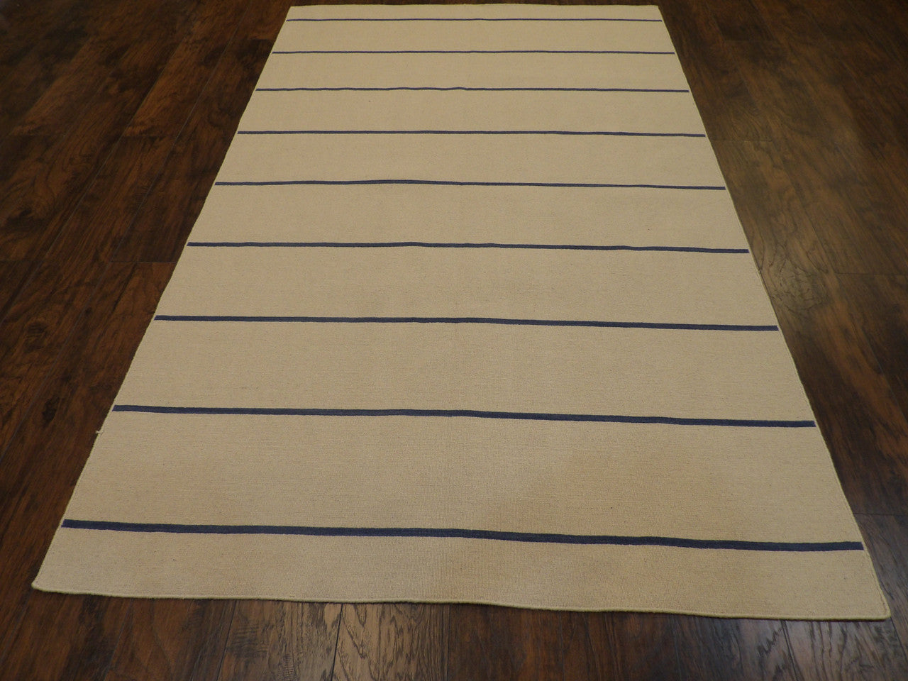 Back of hand-knotted coastal rug showing reversible weave