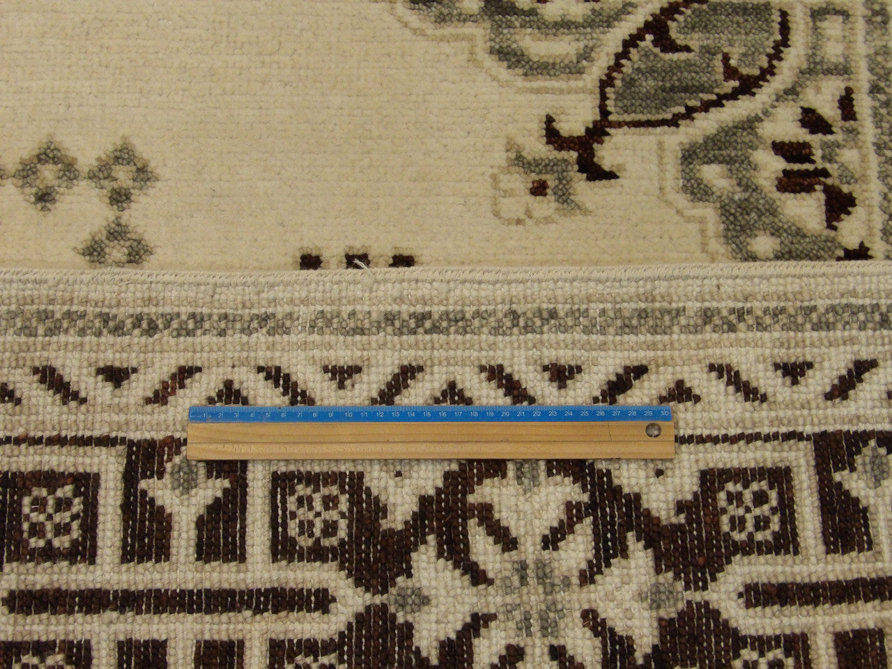 Full room view of Oushak Kazak hand-knotted rug