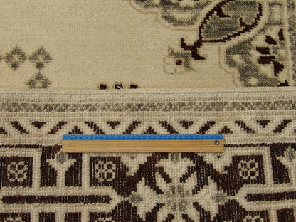 Full room view of Oushak Kazak hand-knotted rug