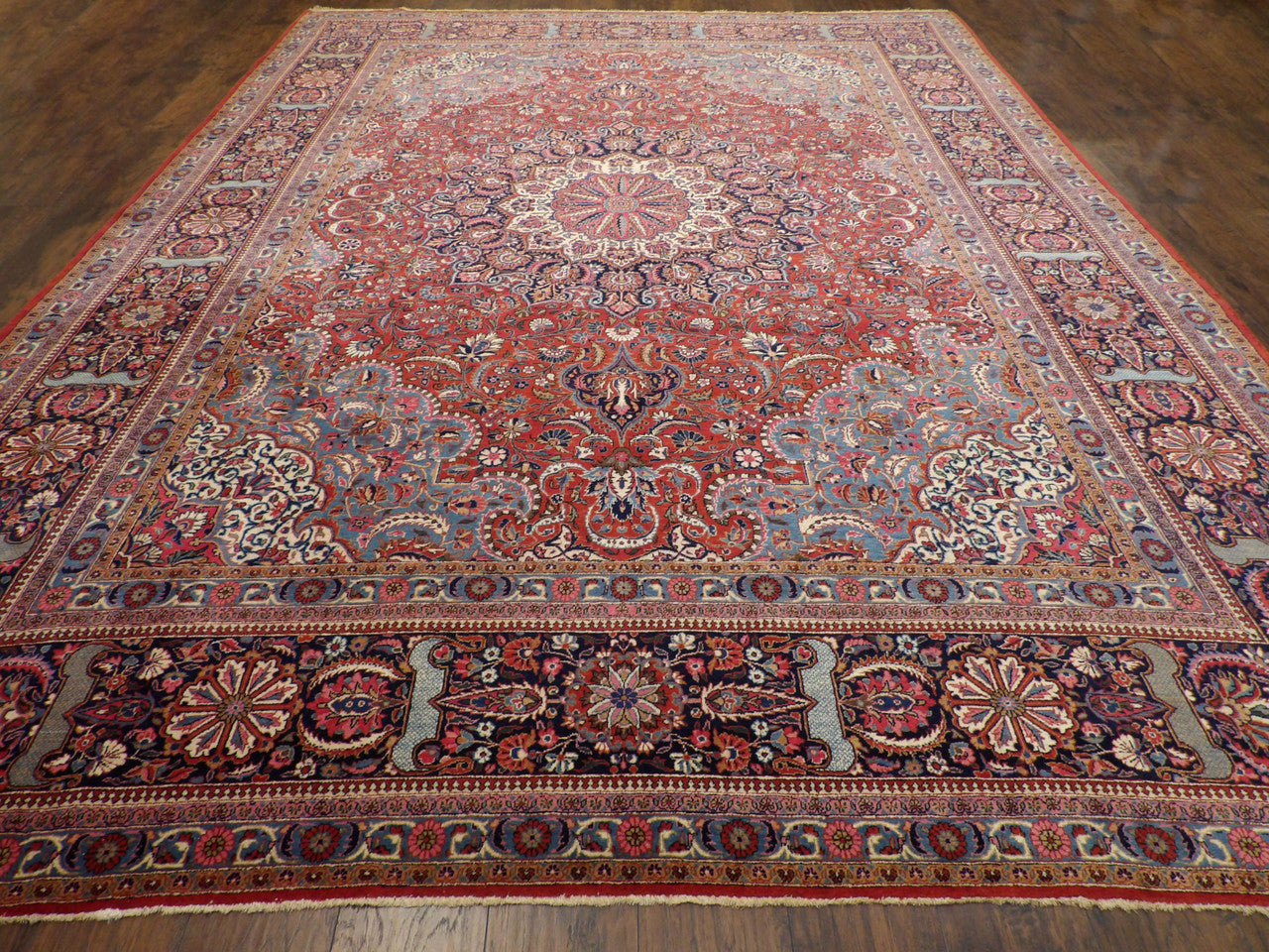 Close-up of wool pile, antique blue and red rug