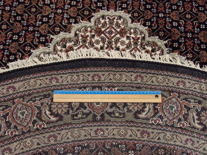 Black Fine Persian Mahi Tabriz rug in room setting