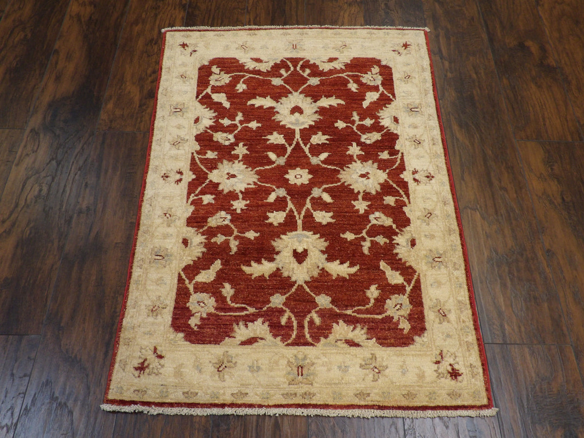 Close-up of wool pile, beige and red rug