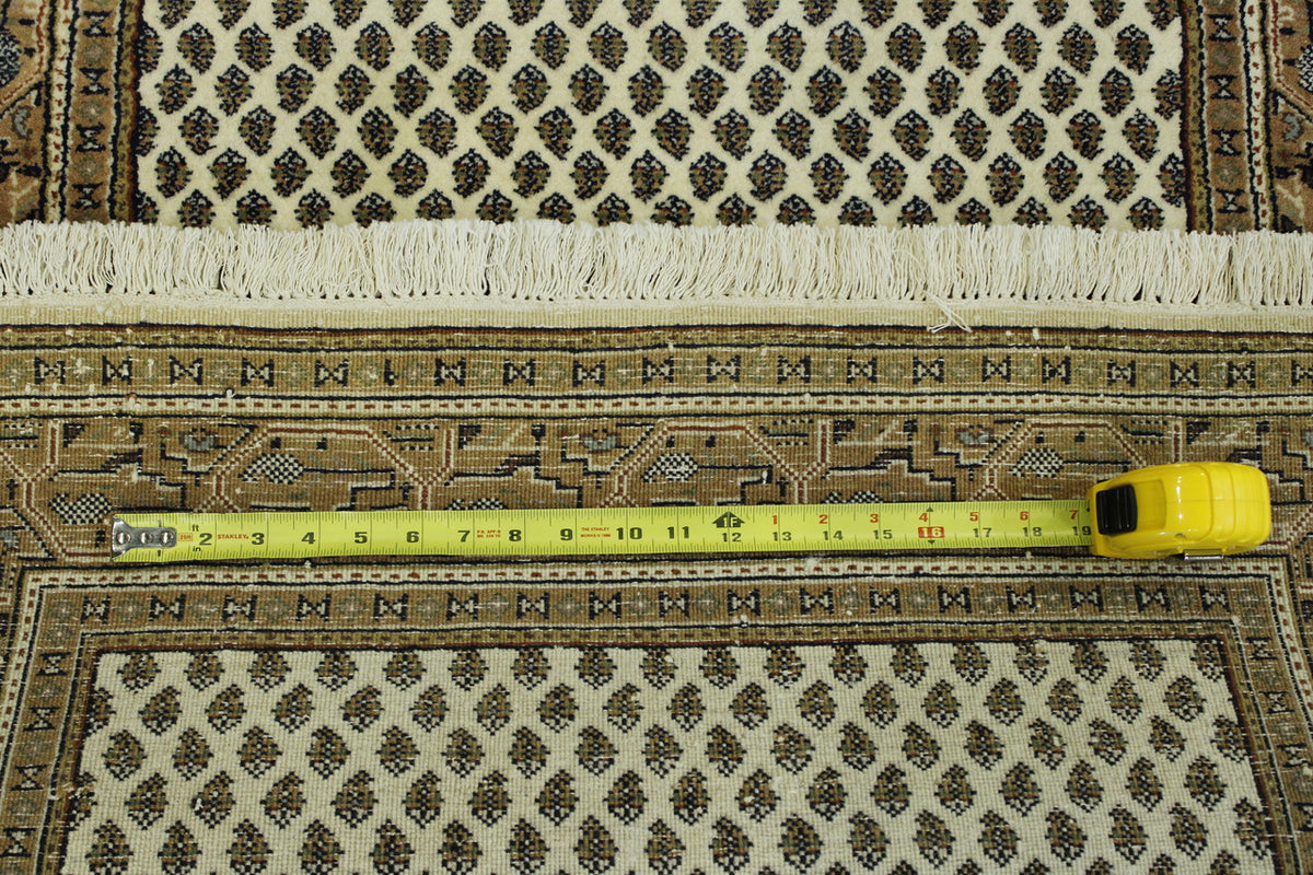Beige & Pink Traditional Indo Mir rug in room setting
