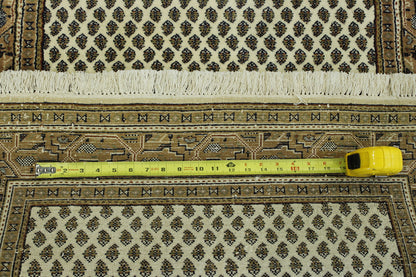 Beige & Pink Traditional Indo Mir rug in room setting