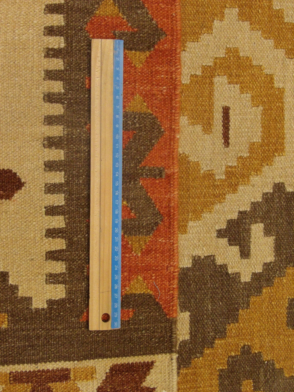 Full room view of tribal kilim southwestern hand-knotted rug