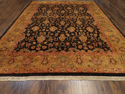 Close-up of thick wool pile, black and gold rug